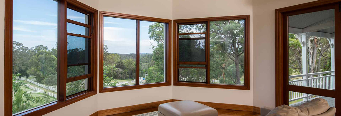 Guardian fall prevention window screens installed on a home